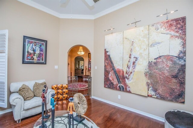 6242 Agassi Ace Ct, Spring, TX 77379 - sitting room featuring arched walkways, wood finished floors, a ceiling fan, and ornamental molding
