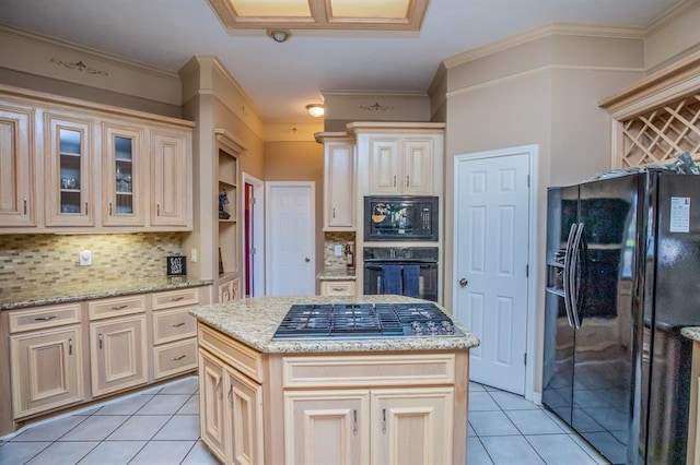 6242 Agassi Ace Ct, Spring, TX 77379 - kitchen featuring black appliances, light tile patterned floors, backsplash, cream cabinetry, and crown molding