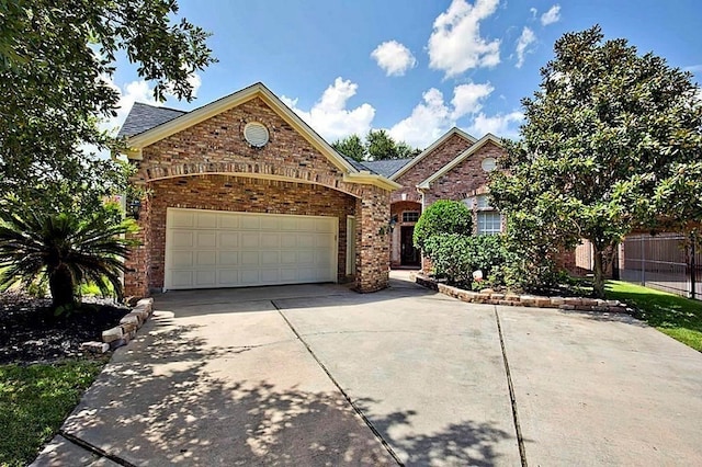 6242 Agassi Ace Ct, Spring, TX 77379 - traditional-style house with driveway, brick siding, and a garage