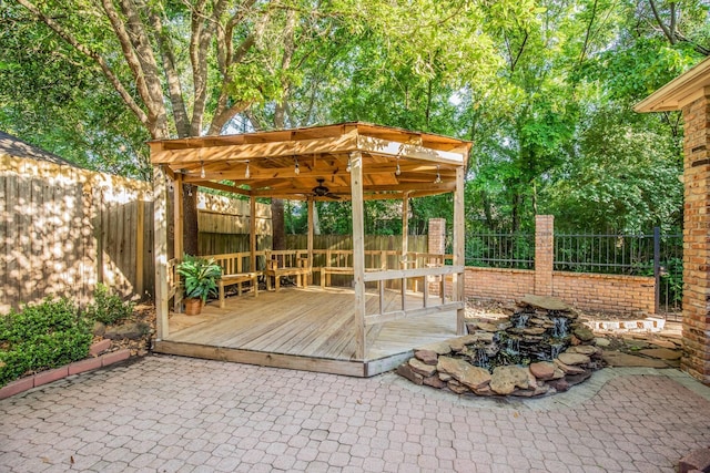 6242 Agassi Ace Ct, Spring, TX 77379 - fenced backyard with a gazebo, ceiling fan, a patio, and a wooden deck