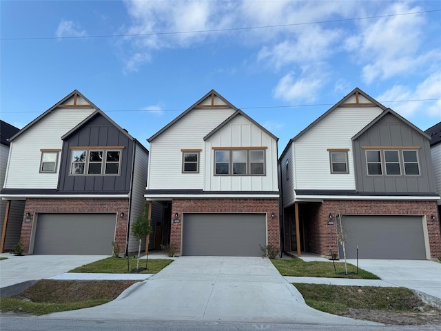 8426 Vogue Ln, Houston, TX 77055 - view of front of house with board and batten siding and an attached garage