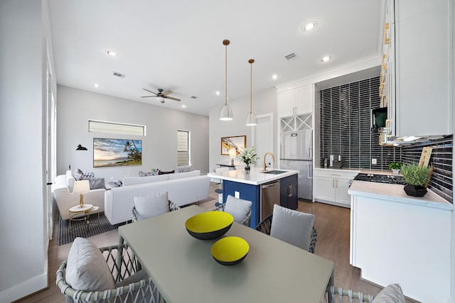8426 Vogue Ln, Houston, TX 77055 - dining room featuring a ceiling fan, dark wood finished floors, and recessed lighting