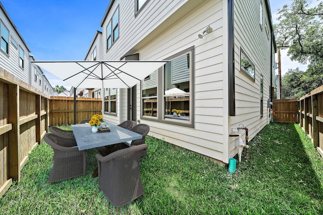 8426 Vogue Ln, Houston, TX 77055 - fenced backyard featuring outdoor dining area