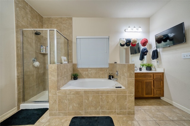 4719 Echo Bay Dr, Baytown, TX 77523 - full bath featuring tile patterned floors, vanity, a bath, and a stall shower