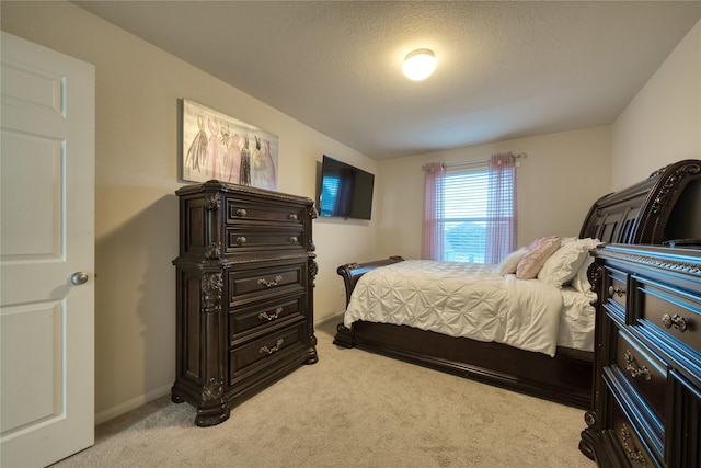 4719 Echo Bay Dr, Baytown, TX 77523 - bedroom featuring light carpet and a textured ceiling