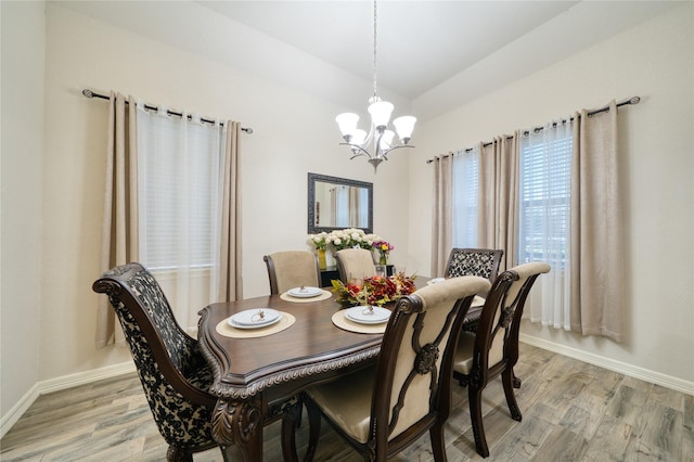 4719 Echo Bay Dr, Baytown, TX 77523 - dining area featuring a chandelier, light wood-style floors, and lofted ceiling