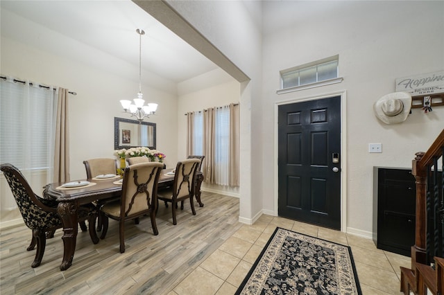 4719 Echo Bay Dr, Baytown, TX 77523 - foyer with a chandelier, a high ceiling, and light wood-style flooring