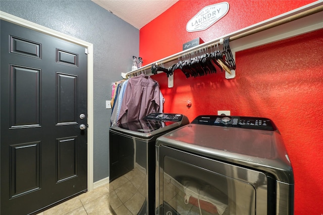4719 Echo Bay Dr, Baytown, TX 77523 - laundry room featuring washer and clothes dryer, a textured wall, tile patterned flooring, and a textured ceiling