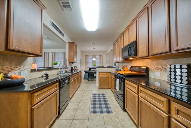 4719 Echo Bay Dr, Baytown, TX 77523 - kitchen featuring black appliances, a peninsula, backsplash, and brown cabinets