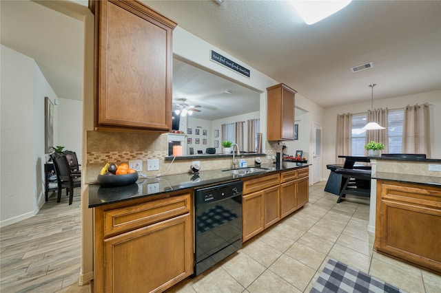 4719 Echo Bay Dr, Baytown, TX 77523 - kitchen featuring dishwasher, backsplash, dark countertops, brown cabinets, and pendant lighting