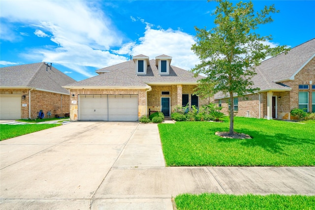 4719 Echo Bay Dr, Baytown, TX 77523 - view of front facade featuring brick siding, an attached garage, driveway, a front yard, and roof with shingles