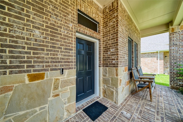 4719 Echo Bay Dr, Baytown, TX 77523 - view of exterior entry with covered porch and brick siding
