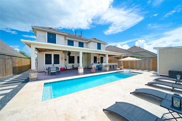 4719 Echo Bay Dr, Baytown, TX 77523 - rear view of house featuring a ceiling fan, a fenced backyard, a patio, and an outdoor hangout area