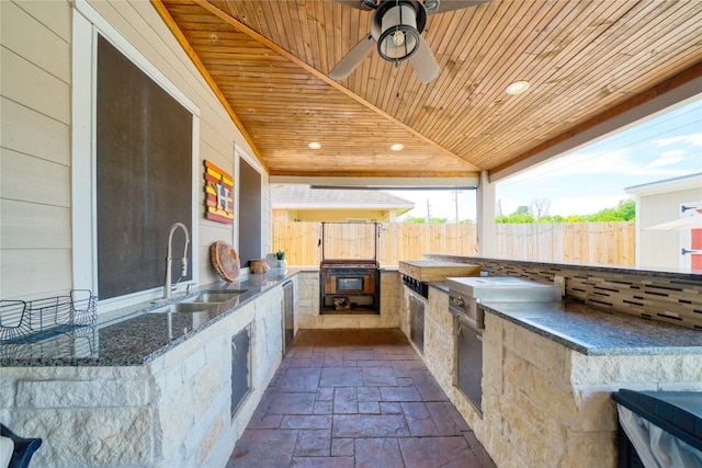 4719 Echo Bay Dr, Baytown, TX 77523 - view of patio with an outdoor kitchen and ceiling fan