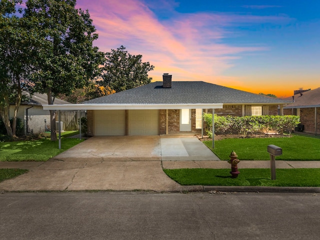 1517 Van Buren Dr, Deer Park, TX 77536 - view of front of home with a garage, a front lawn, a chimney, and brick siding