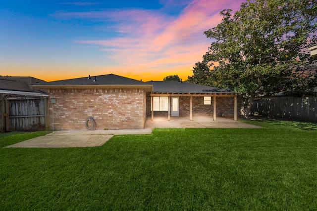 1517 Van Buren Dr, Deer Park, TX 77536 - back of house featuring a patio area, brick siding, and a fenced backyard