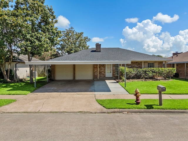 1517 Van Buren Dr, Deer Park, TX 77536 - view of front facade with an attached garage, a front yard, a chimney, and driveway