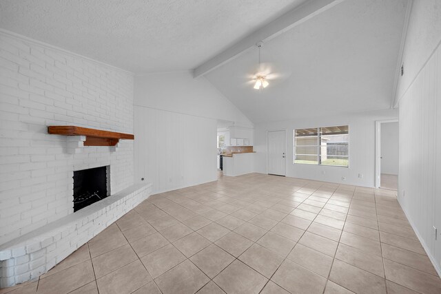 1517 Van Buren Dr, Deer Park, TX 77536 - unfurnished living room with light tile patterned floors, a fireplace, and a textured ceiling