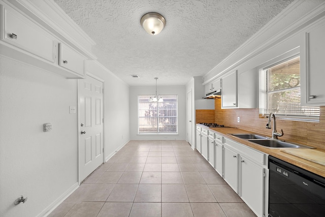 1517 Van Buren Dr, Deer Park, TX 77536 - kitchen with black dishwasher, under cabinet range hood, decorative backsplash, a chandelier, and white cabinetry