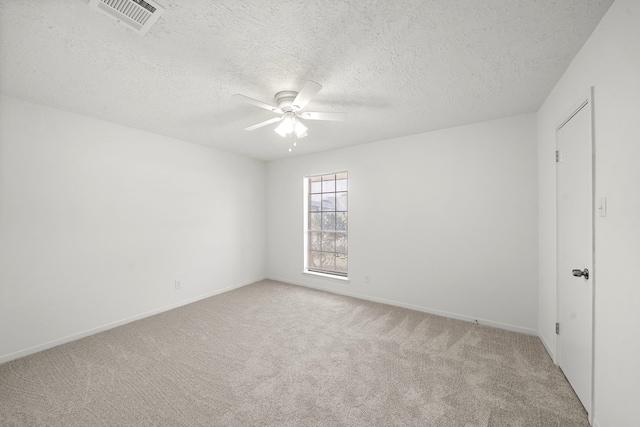 1517 Van Buren Dr, Deer Park, TX 77536 - carpeted spare room featuring a ceiling fan and a textured ceiling