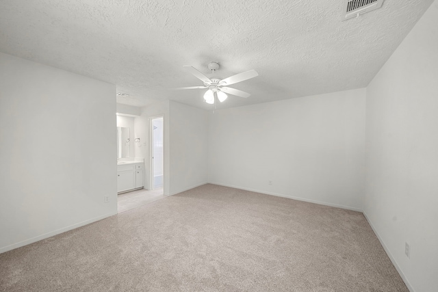 1517 Van Buren Dr, Deer Park, TX 77536 - unfurnished room featuring light carpet, ceiling fan, and a textured ceiling
