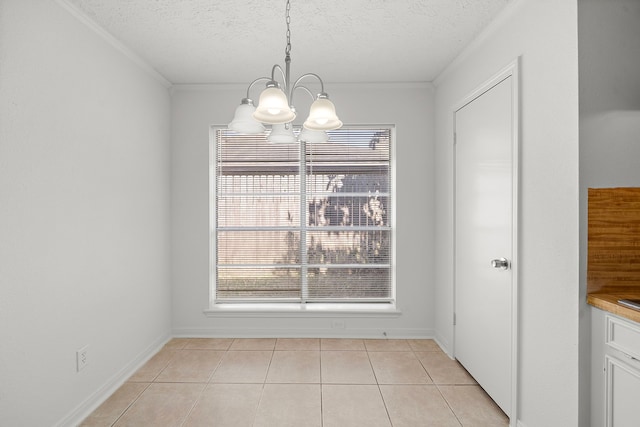 1517 Van Buren Dr, Deer Park, TX 77536 - unfurnished dining area featuring a chandelier, light tile patterned floors, a textured ceiling, and crown molding