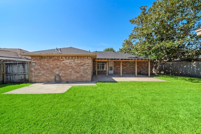 1517 Van Buren Dr, Deer Park, TX 77536 - back of property featuring a patio area, a fenced backyard, and brick siding