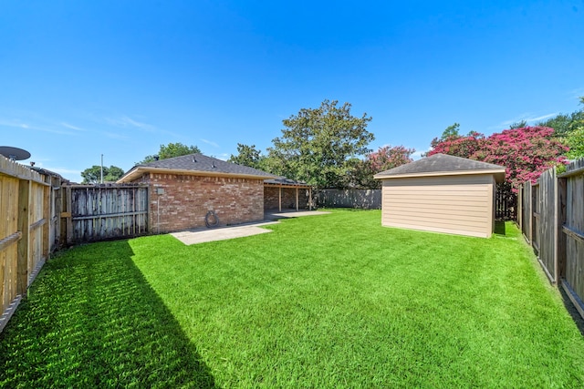 1517 Van Buren Dr, Deer Park, TX 77536 - fenced backyard with a patio area