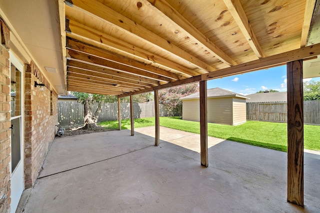 1517 Van Buren Dr, Deer Park, TX 77536 - fenced backyard with a patio area and an outbuilding