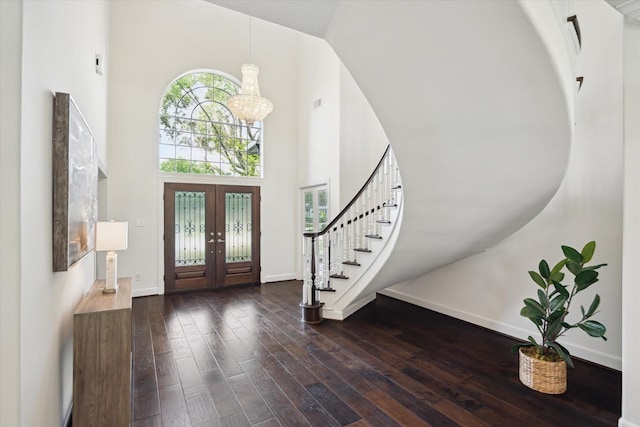 13418 Pristine Park Dr, Houston, TX 77041 - foyer featuring a towering ceiling, stairs, dark wood finished floors, a chandelier, and french doors