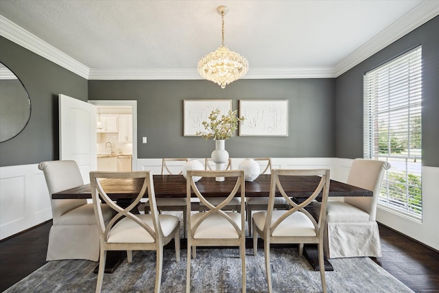 13418 Pristine Park Dr, Houston, TX 77041 - dining room with a chandelier, ornamental molding, a wainscoted wall, and dark wood finished floors