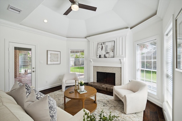 13418 Pristine Park Dr, Houston, TX 77041 - living room with plenty of natural light, a tile fireplace, crown molding, a raised ceiling, and ceiling fan