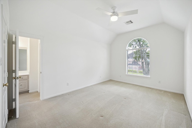 13418 Pristine Park Dr, Houston, TX 77041 - unfurnished bedroom with vaulted ceiling, light colored carpet, ceiling fan, and connected bathroom