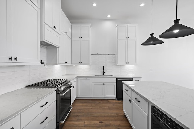 1706 Sedola Ln, Houston, TX 77055 - kitchen featuring gas stove, dishwasher, recessed lighting, white cabinets, and dark wood-style floors