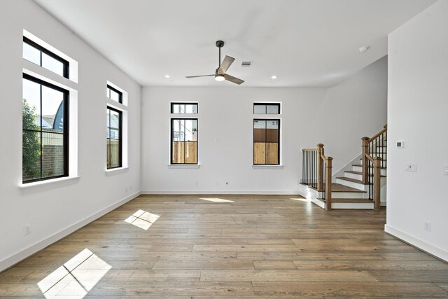 1706 Sedola Ln, Houston, TX 77055 - unfurnished living room featuring ceiling fan, stairway, wood finished floors, and recessed lighting