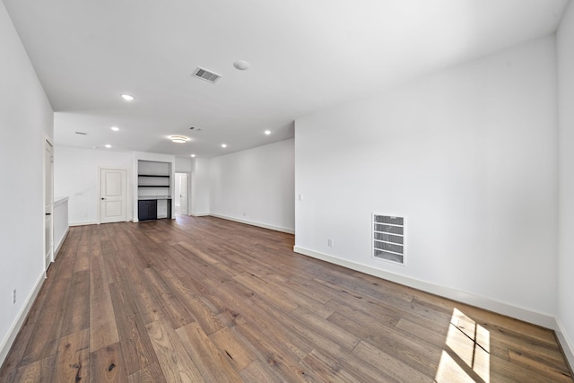 1706 Sedola Ln, Houston, TX 77055 - unfurnished living room featuring wood finished floors and recessed lighting