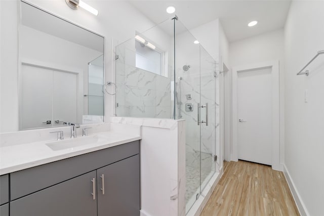 2109 Holman, Houston, TX 77004 - full bath with a marble finish shower, vanity, wood finished floors, and recessed lighting