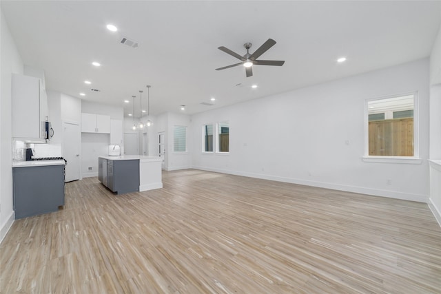 2109 Holman, Houston, TX 77004 - unfurnished living room with light wood-type flooring, ceiling fan, and recessed lighting