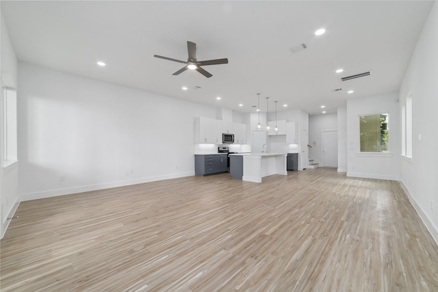 2109 Holman, Houston, TX 77004 - unfurnished living room featuring light wood-style flooring, recessed lighting, and a ceiling fan