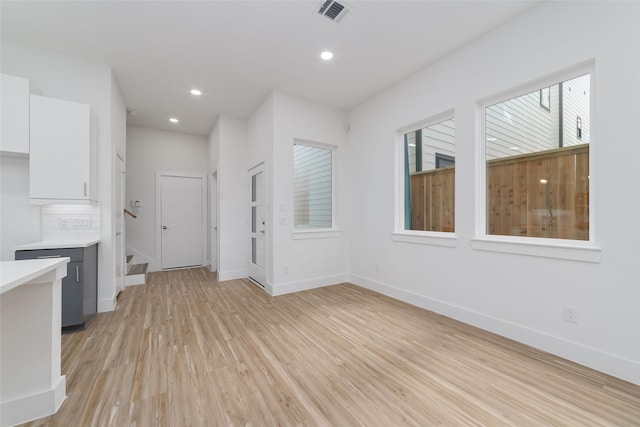 2109 Holman, Houston, TX 77004 - unfurnished living room with light wood-style flooring and recessed lighting