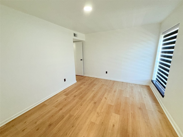 9090 S Braeswood Blvd Unit 115, Houston, TX 77074 - unfurnished room with light wood-style flooring and baseboards