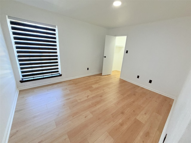 9090 S Braeswood Blvd Unit 115, Houston, TX 77074 - empty room with light wood-style flooring and recessed lighting