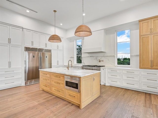 430 81st St, Galveston, TX 77554 - kitchen with stainless steel appliances, healthy amount of natural light, recessed lighting, and light wood-type flooring