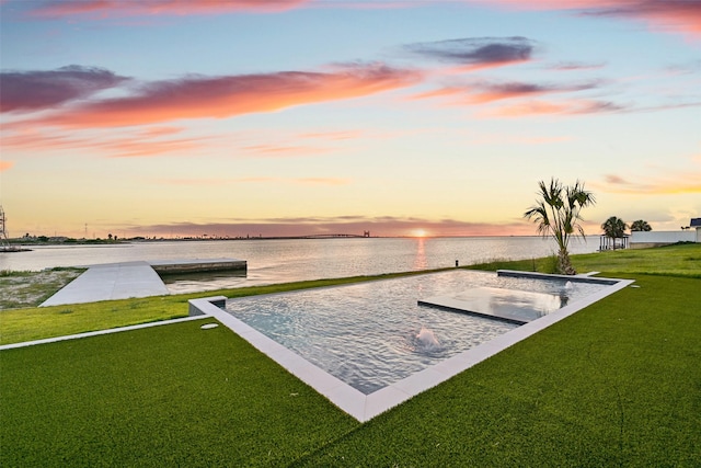 430 81st St, Galveston, TX 77554 - pool at dusk with a water view and a yard