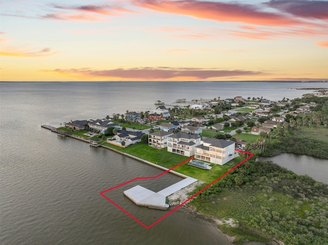 430 81st St, Galveston, TX 77554 - aerial view at dusk of a water view and a residential view