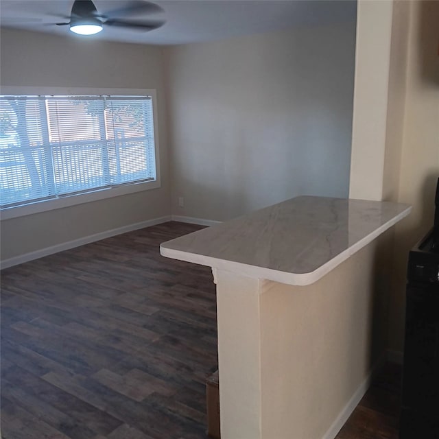 7924 Elvera St, Houston, TX 77012 - empty room with a ceiling fan and dark wood-style flooring