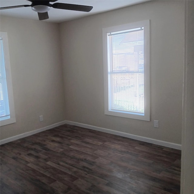 7924 Elvera St, Houston, TX 77012 - empty room featuring a ceiling fan, plenty of natural light, and dark wood-style flooring