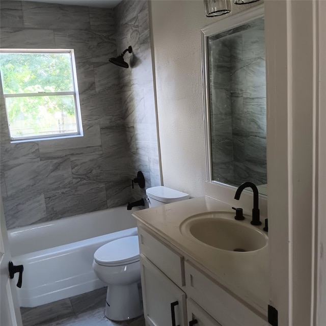 7924 Elvera St, Houston, TX 77012 - bathroom featuring vanity, washtub / shower combination, and a textured wall
