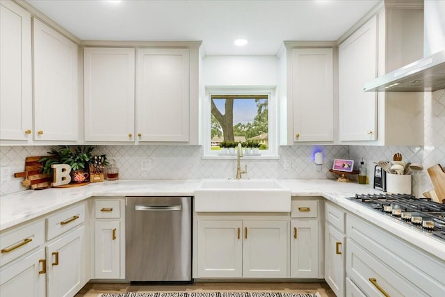 3220 Patricia Ln, Pearland, TX 77581 - kitchen with appliances with stainless steel finishes, wall chimney range hood, tasteful backsplash, light stone countertops, and recessed lighting