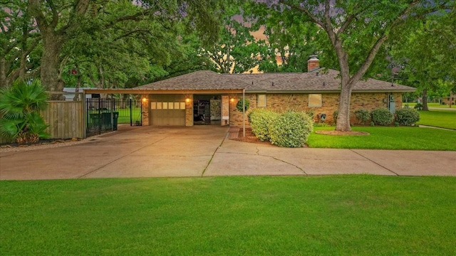 3220 Patricia Ln, Pearland, TX 77581 - ranch-style house featuring a garage, a chimney, brick siding, driveway, and a carport
